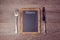 Creative menu background with chalkboard and silverware. View from above