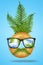 Creative minimal concept fan face man made of donut with sunglasses, green tropical leaf palm on bright pastel blue