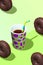 Creative minimal food design 3d render chocolate donuts and coffee cup in isometry fresh green space.  Restaurant, bakery, candy