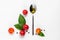 Creative mockup with tomato slices, basil leaves and a spoonful of olive oil. Flat lay, top view. Food concept. Vegetables