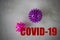 The creative mockup of the virus is purple and pink. Coronavirus infection concept.