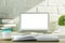 Creative modern desk top with white laptop