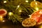 Creative moody holiday Christmas New Year food fruits with dried grapefruit, kiwi, orange and lemon with branch of fir tree