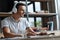 Creative motivated man listening to music at his workplace