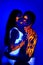 Creative neon light man and woman beauty make up body art