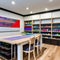 A creative and organized craft room with ample storage, a large work table, and colorful art supplies4, Generative AI