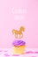 Creative pastel holiday card with cupcake and unicorn with Celebrate online wording. Baby shower, birthday, celebration