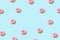 Creative pattern with donut on blue background. Minimal summer concept
