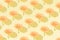 Creative pattern made with flowers on a yellow background. Minimal Women`s day and spring concept