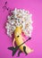 Creative photo of a banana that plays rock. Funny rocker musician