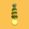 Creative pineapple layout. Whole fruit on bright yellow
