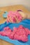 Creative play for children. Education and parenting. Children playing with pink kinetik sand