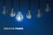 Creative Power , Creativity innovation illuminated light bulb row dim ones concept solution