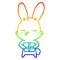 A creative rainbow gradient line drawing curious bunny cartoon with present