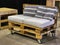 Creative re-use of storage and delivery woodden pallets for handcrafted sofa