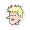 A creative retro distressed sticker of a cartoon happy boy face