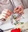 Creative senior woman making ornaments