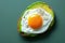 A creative shot of a fried egg on a slice of avocado, creating a vibrant contrast