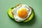 A creative shot of a fried egg on a slice of avocado, creating a vibrant contrast