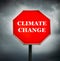 Creative Sign-Stop Climate Change with dark clouds