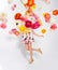 Creative spring composition. Dancing girl and flowers splash