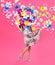 Creative spring composition. Dancing girl and flowers splash