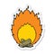 A creative sticker of a cartoon blazing camp fire