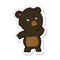 A creative sticker of a cartoon curious black bear