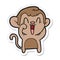 A creative sticker of a cartoon laughing monkey