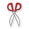 A creative sticker of a cartoon pair of scissors
