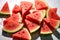 A creative summer concept vibrant watermelon slices with dramatic shadows