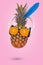 Creative summer invitation card with pineapple wearing sunglasses made of fresh orange and headphones on pink background