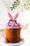 Creative traditional easter cake decorated with a bunny ears. Easter cake decoration.