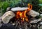 Creative Travel Cooking idea: Cooking with fire flame by using stone as a pot