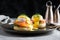 creative twist on Eggs Benedict with a layer of smoked salmon and a sprinkle of dill on top of the perfectly poached egg