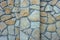 A creative wall made of natural stone. Brown vintage background.