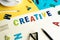 Creative word on desk office background with supplies