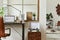 Creative workspace composition of modern masculine home office interior with black industrial desk, leather armchair, laptop.