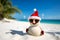 Creative Xmas and New Year background with Sandy snowman. Imitation of sandy Christmas snowman in red santa hat and sunglasses at