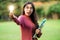 Creative young woman hold shinning light bulb.