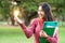 Creative young woman hold shinning light bulb.