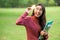 Creative young woman hold shinning light bulb.