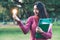 Creative young woman hold shinning light bulb.