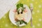 Creatively decorated pig salad. Children`s menu on a green background.