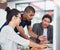 Creatives at work. a group of designers talking together while sitting at their workstations in an office.