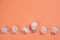 Creativity inspiration, great business idea concept with white light bulb and paper crumpled ball on orange background.
