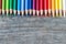 Creativity: Multi-colored pencils on rustic wooden table