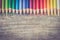Creativity: Multi-colored pencils on rustic wooden table