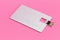 Credit card flash memory on a pink background