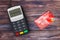 Credit Card Payment Terminal with Red Credit Card. 3d Rendering